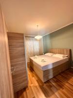 Posteľ alebo postele v izbe v ubytovaní Sea and Lemon Tree apartment
