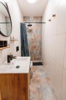 a bathroom with a sink and a shower at Panorama Górska Wisła Resort & SPA in Wisła