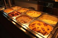 a buffet line with different types of food in trays at Panorama Górska Wisła Resort & SPA in Wisła