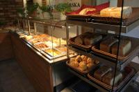 a bakery with many different types of bread and pastries at Panorama Górska Wisła Resort & SPA in Wisła