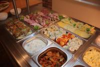 a buffet with many different types of food at Panorama Górska Wisła Resort & SPA in Wisła