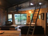a room with a bunk bed and a ladder at Magnifique loft atypique proche gare et bord de rivière in Le Mans