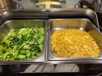 two metal trays of food with broccoli and cheese at Link World Hotel in Taipei