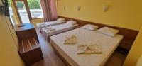 A bed or beds in a room at Complex Dobrudja
