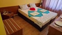 A bed or beds in a room at Complex Dobrudja