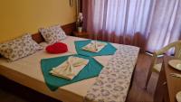 A bed or beds in a room at Complex Dobrudja