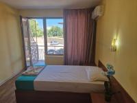 A bed or beds in a room at Complex Dobrudja