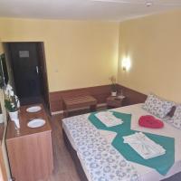 A bed or beds in a room at Complex Dobrudja