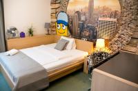 Łóżko lub łóżka w pokoju w obiekcie Hotel a Museum of Bricks