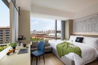lyf Xi'an Dayanta by Ascott free gym & self-service free laundry roomにあるベッド