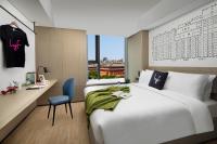 lyf Xi'an Dayanta by Ascott free gym & self-service free laundry roomにあるベッド