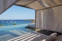 a villa with a swimming pool and a view of the ocean at Hotel & Spa Blau Parc in San Antonio