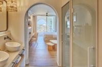 a bathroom with an archway leading to a bedroom at Hotel & Spa Blau Parc in San Antonio