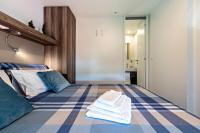 A bed or beds in a room at Casa Mobile Est Garda