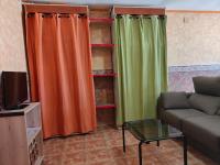 A television and/or entertainment centre at Apartamentos Matraca