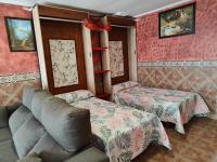 A bed or beds in a room at Apartamentos Matraca