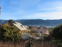 a house with a mountain in the background at Studio Autrans, 1 pièce, 3 personnes - FR-1-737-33 in Autrans