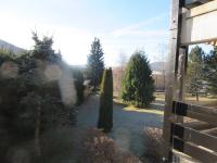 a view of a yard with trees and a fence at Studio Autrans, 1 pièce, 3 personnes - FR-1-737-33 in Autrans