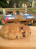 a loaf of bread sitting on top of a table at Nisaki Mathraki B&B in Corfu Town
