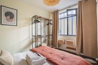 a bedroom with a bed and a window at Apartment Center of Paris by Studio prestige in Paris