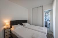 A bed or beds in a room at Studio cosy, 4Pers, wifi, proche Disney, Parking - Fairytale Factory