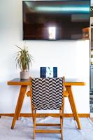 Televízia a/alebo spoločenská miestnosť v ubytovaní Panorama Loft