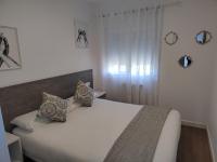Posteľ alebo postele v izbe v ubytovaní Apartamentos en Leis Muxia