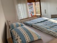 Posteľ alebo postele v izbe v ubytovaní Apartmani G&E