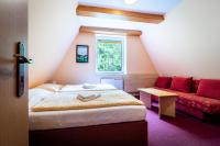 Postel nebo postele na pokoji v ubytování Hotel Sluníčko