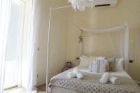 A bed or beds in a room at Ai due Mori Apt by Addler House Ospitality