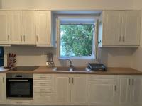 a kitchen with a sink and a window at Diakofti house by the sea - Kythoikies hoilday houses in Kythira