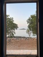 a view of the water from a window at Diakofti house by the sea - Kythoikies hoilday houses in Kythira