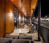 a patio with a table and chairs on a balcony at The Haywood, Tapestry Collection by Hilton in El Dorado
