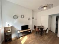 a living room with a table and a dining room at Appartement Turquoise - 2 pers - Sedan in Sedan