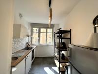a small kitchen with a sink and a refrigerator at Appartement Turquoise - 2 pers - Sedan in Sedan