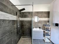 a bathroom with a glass shower and a sink at Appartement Turquoise - 2 pers - Sedan in Sedan