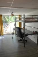 a room with bunk beds and a desk and a chair at Maison Amandre en Pleine Nature - Mas Lou Castanea in Collobrières