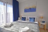 Łóżko lub łóżka w pokoju w obiekcie Sunset Apartments - Kormoran - Plaża 300m