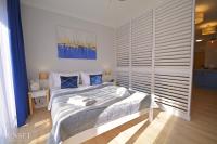 Łóżko lub łóżka w pokoju w obiekcie Sunset Apartments - Kormoran - Plaża 300m