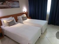 Posteľ alebo postele v izbe v ubytovaní Green Hotel Ninfa