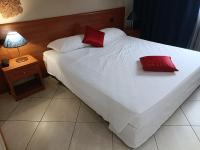 Posteľ alebo postele v izbe v ubytovaní Green Hotel Ninfa