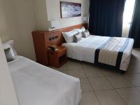 Posteľ alebo postele v izbe v ubytovaní Green Hotel Ninfa