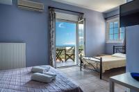 A bed or beds in a room at Ionian Balcony 2
