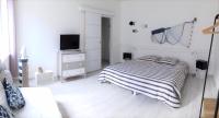 Łóżko lub łóżka w pokoju w obiekcie Gîte Escale en vue - 3 Chambres - 150 m de la plage -