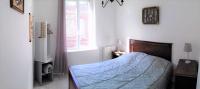 Łóżko lub łóżka w pokoju w obiekcie Gîte Escale en vue - 3 Chambres - 150 m de la plage -