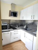 Kuchyň nebo kuchyňský kout v ubytování Lazur Apartamenty