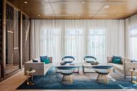 a living room with couches and a table at Marriott Fort Lauderdale Airport in Dania Beach