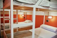 A bed or beds in a room at LOFT HOSTAL Group