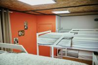 A bed or beds in a room at LOFT HOSTAL Group