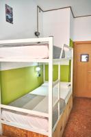 A bed or beds in a room at LOFT HOSTAL Group